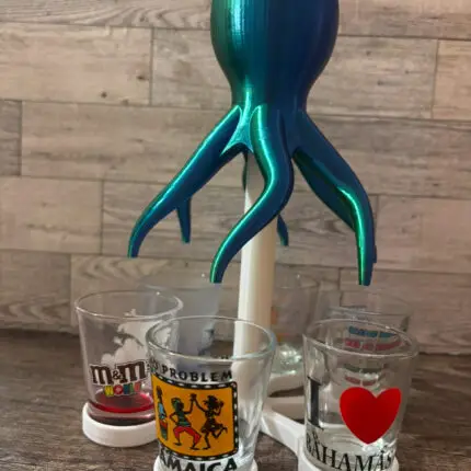 Unleash the beast of the deep at your next party with our 3D-printed Shot Dispenser! This two-piece marvel is here to make your gatherings unforgettable—and a little mysterious. Perfect for entertaining, this unique dispenser will pour your favorite spirits into six shot glasses simultaneously, ensuring everyone gets a taste of the action.