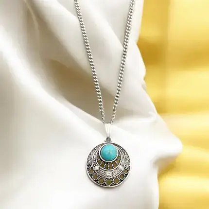 This exquisite Boho necklace features a stunning turquoise stone pendant elegantly suspended from a sleek silver chain. The imitation turquoise stone offers a vibrant pop of color, making it a perfect accessory for both casual and formal attire. Its unique design embodies a free-spirited aesthetic, ideal for those who appreciate a blend of natural beauty and contemporary style.