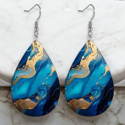 Elevate your style with these stunning blue and gold marble teardrop earrings, crafted from high-quality PU leather. Their unique design adds a touch of elegance to any outfit, making them perfect for both casual and formal occasions. Lightweight and comfortable, these earrings are a must-have accessory for anyone looking to make a statement.