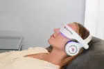 Woman wearing a BrainTap Headset relaxing