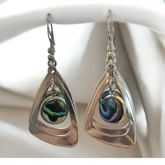 Crafted from durable stainless steel, these Silver Dangling earrings featuring a unique  abalone shell in bezel setting