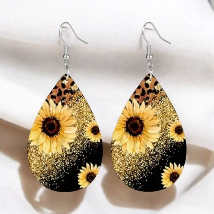 These sunflower printed earrings are a fun and stylish accessory that adds a pop of color and a touch of wild flair to any outfit. The vibrant sunflower design contrasts beautifully with the bold leopard and sparkly print, making them perfect for both casual and dressy occasions. Lightweight and easy to wear, these earrings are sure to turn heads and brighten your day!