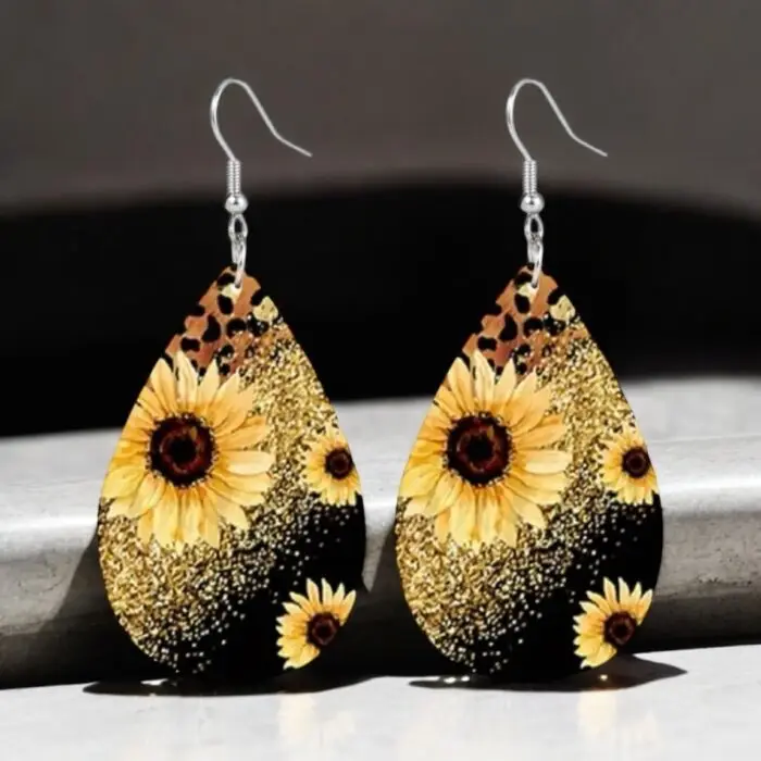 These sunflower printed earrings are a fun and stylish accessory that adds a pop of color and a touch of wild flair to any outfit. The vibrant sunflower design contrasts beautifully with the bold leopard and sparkly print, making them perfect for both casual and dressy occasions. Lightweight and easy to wear, these earrings are sure to turn heads and brighten your day!