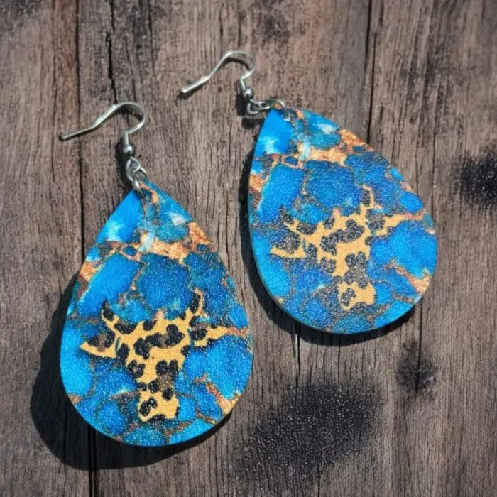 Elevate your style with these cute blue and gold teardrop-shaped earrings, featuring a unique giraffe design that adds a playful touch to any outfit. these earrings are lightweight and comfortable, making them a must-have accessory for any jewelry lover. Shine bright and show off your personality with this eye-catching piece!