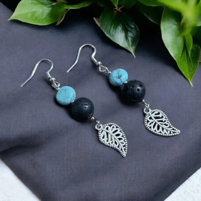 these stunning earrings featuring vibrant turquoise stones and unique lava rock accents. The delicate leaf design adds a touch of nature-inspired elegance, making them perfect for any occasion. Lightweight and comfortable, these earrings are a must-have accessory for those who love to stand out!