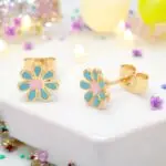 These adorable gold-plated enamel flower stud earrings are perfect for little girls who love to add a touch of charm to their outfits. With their vibrant colors and cute floral design, they’re not just accessories but a delightful way to express personality and style. Lightweight and comfortable, these earrings are ideal for everyday wear or special occasions, making them a must-have for any young fashionista.