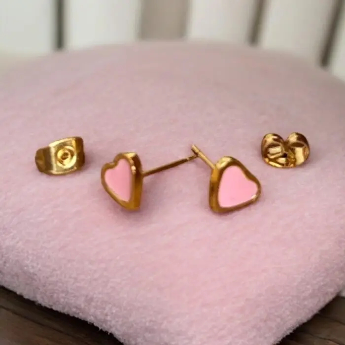 These adorable pink enamel heart stud earrings are the perfect accessory for any little girl who loves to shine. With their charming design and elegant finish, they add a touch of sweetness to any outfit. Lightweight and comfortable, these earrings are ideal for everyday wear or special occasions, making them a delightful gift for birthdays or holidays PSST Adults can wear these beauties too !!