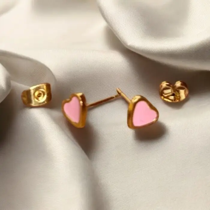 These adorable pink enamel heart stud earrings are the perfect accessory for any little girl who loves to shine. With their charming design and elegant finish, they add a touch of sweetness to any outfit. Lightweight and comfortable, these earrings are ideal for everyday wear or special occasions, making them a delightful gift for birthdays or holidays PSST Adults can wear these beauties too !!