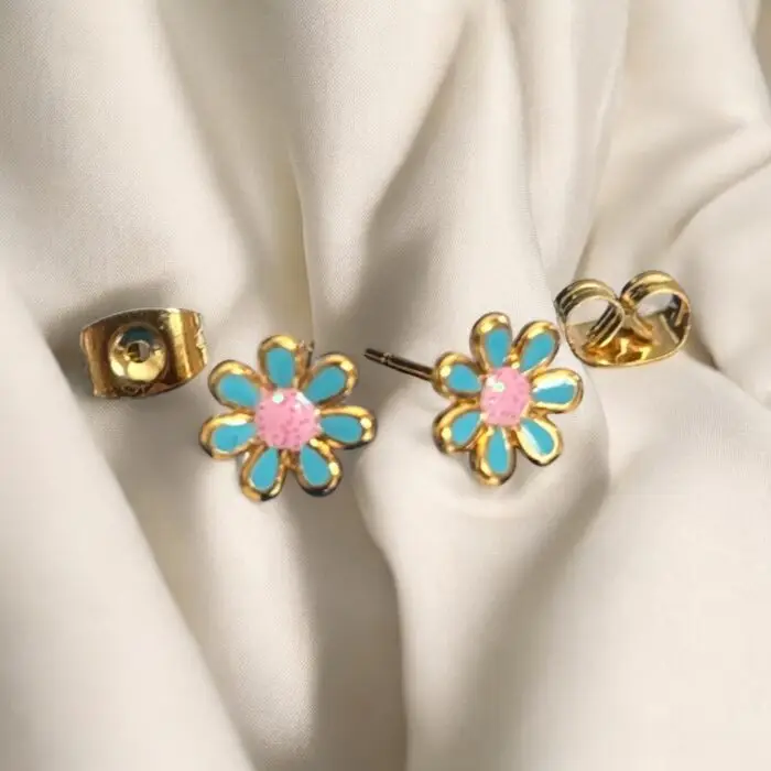 These adorable gold-plated enamel flower stud earrings are perfect for little girls who love to add a touch of charm to their outfits. With their vibrant colors and cute floral design, they’re not just accessories but a delightful way to express personality and style. Lightweight and comfortable, these earrings are ideal for everyday wear or special occasions, making them a must-have for any young fashionista.